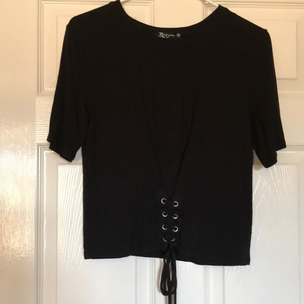 Kids size M black shirt. Pullover with scoop neck and short sleeves. Never worn